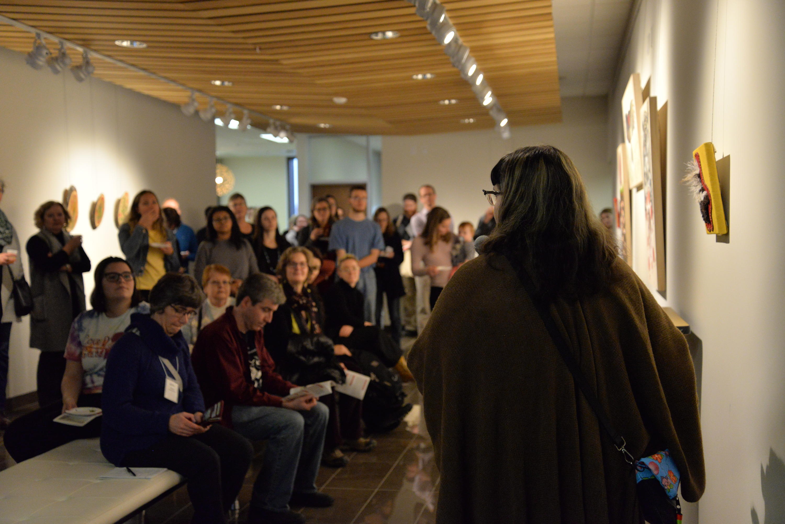 Artist Catherine Dallaire speaks about her pieces at the Gallery Exhibit Launch