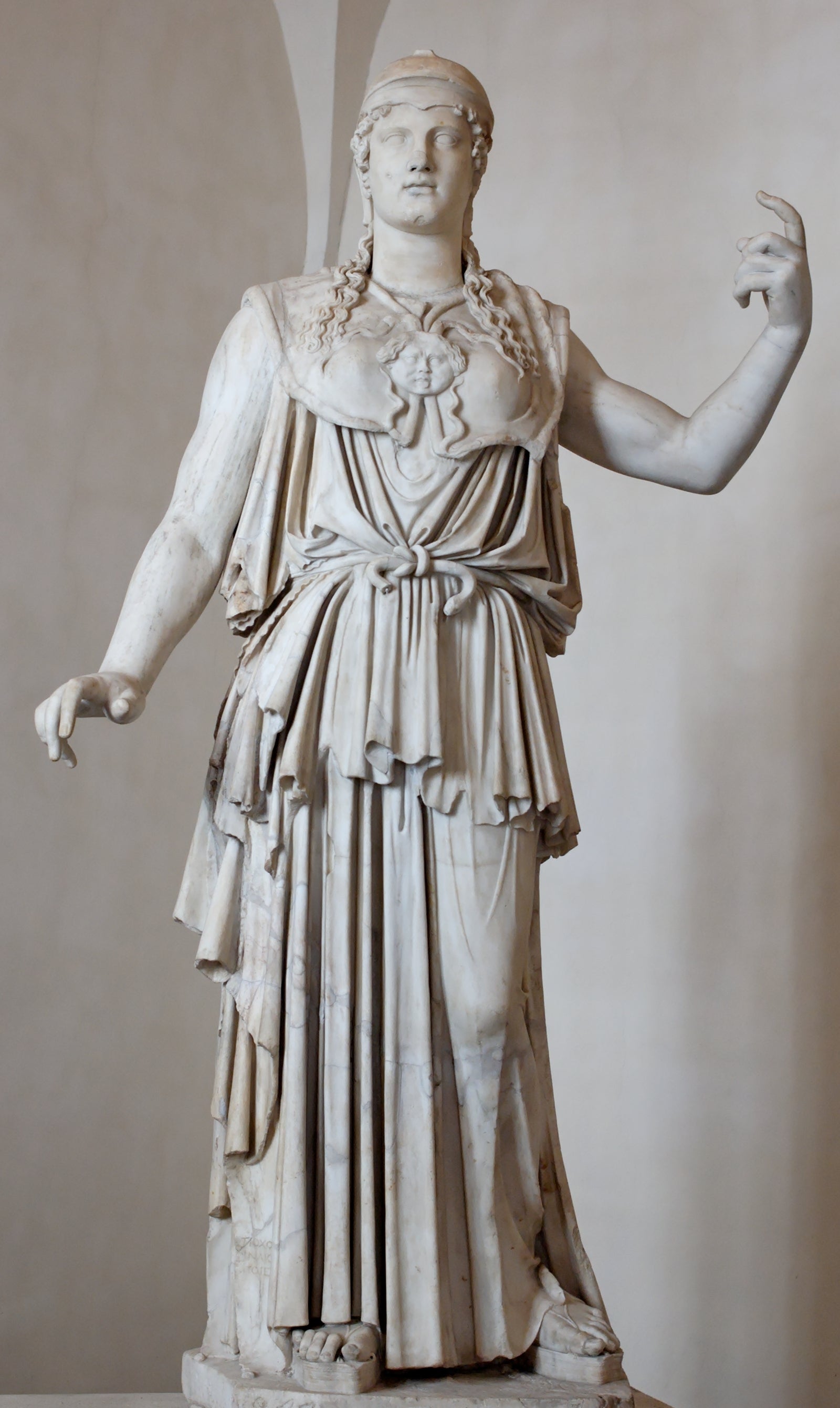 A classical era marble sculpture of the Goddess Athena, a woman in a long, draping dress with a warrior's breastplate