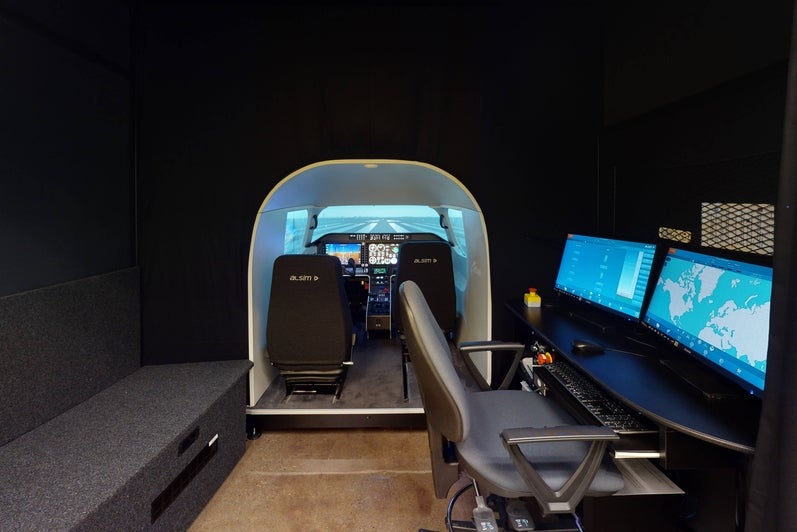 Simulator cockpit and instructor station.