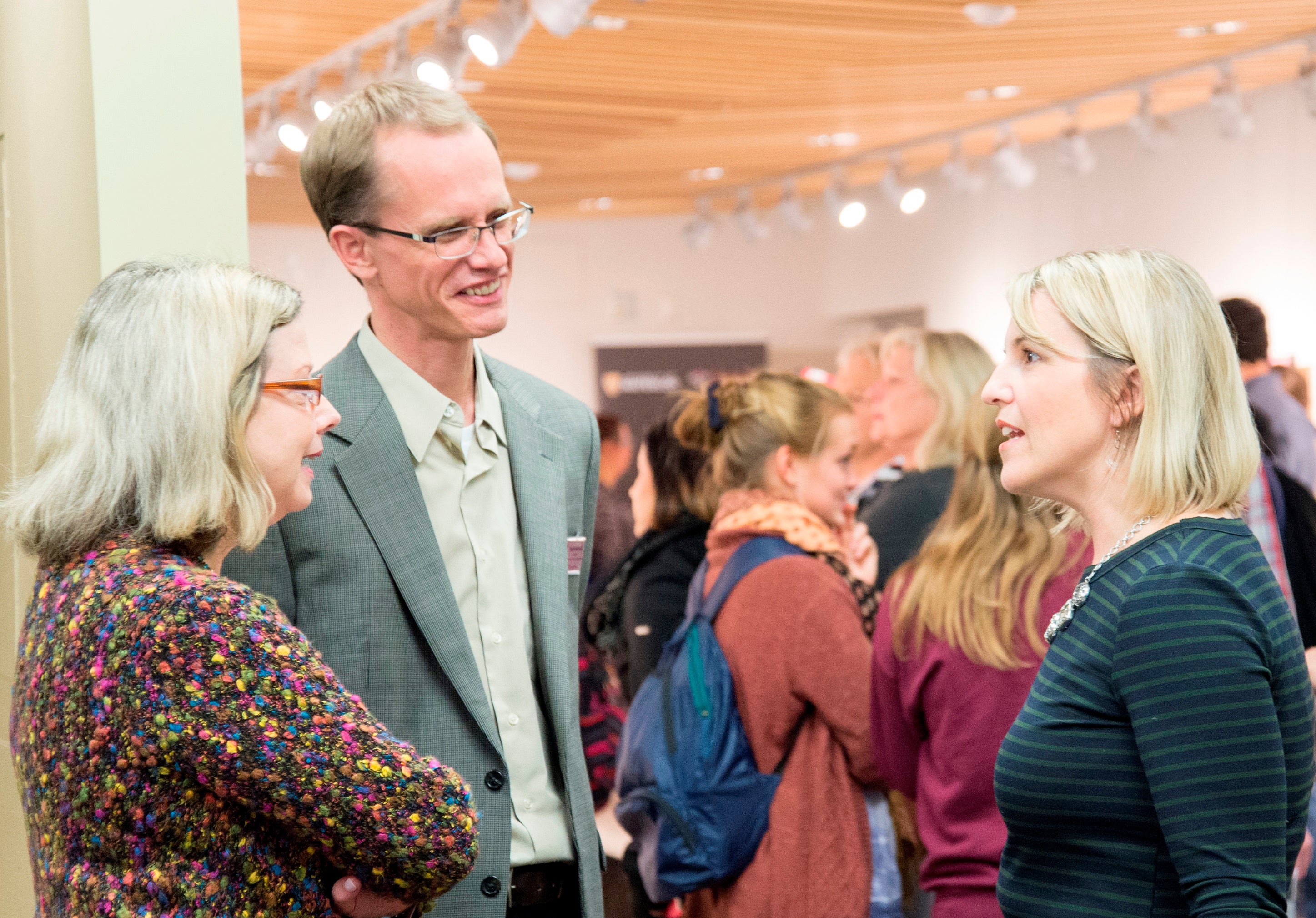 Susan Schultz Human and Paul Heidebrecht visit with Shannon Moroney in the Grebel Gallery