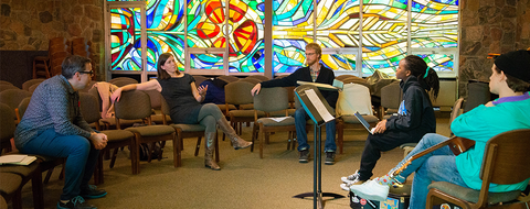 students part of the worship music apprentice program meet with professors in the chapel