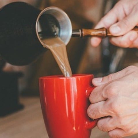 Person pouring coffee