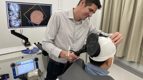 Dr. Ben Thompson working with a participant in a research study.
