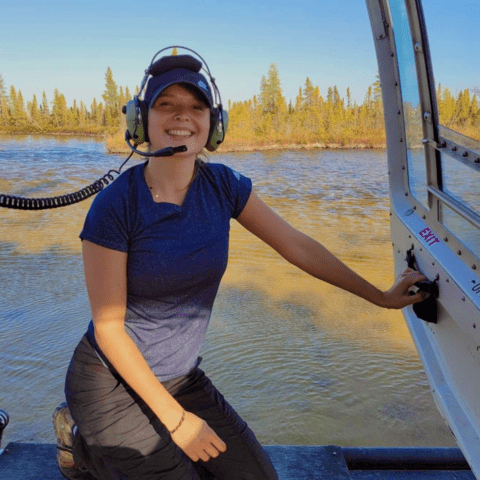Amy Lacey in a helicopter at Whopoping Crane Nesting Region