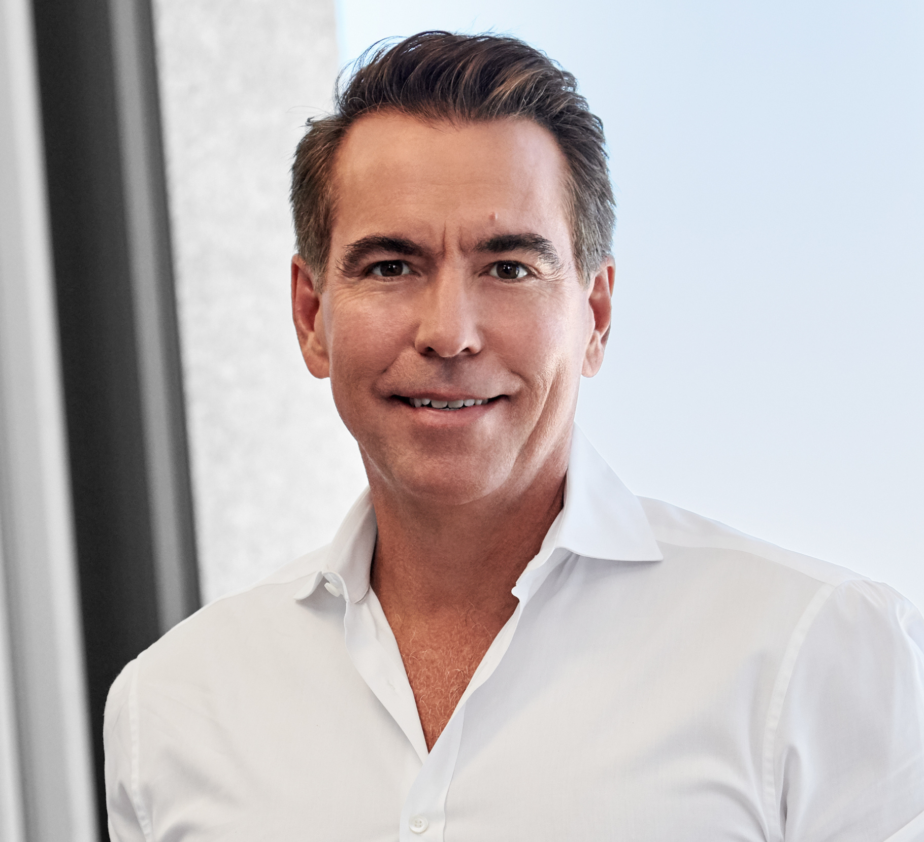 A professional headshot of Orlando Bravo