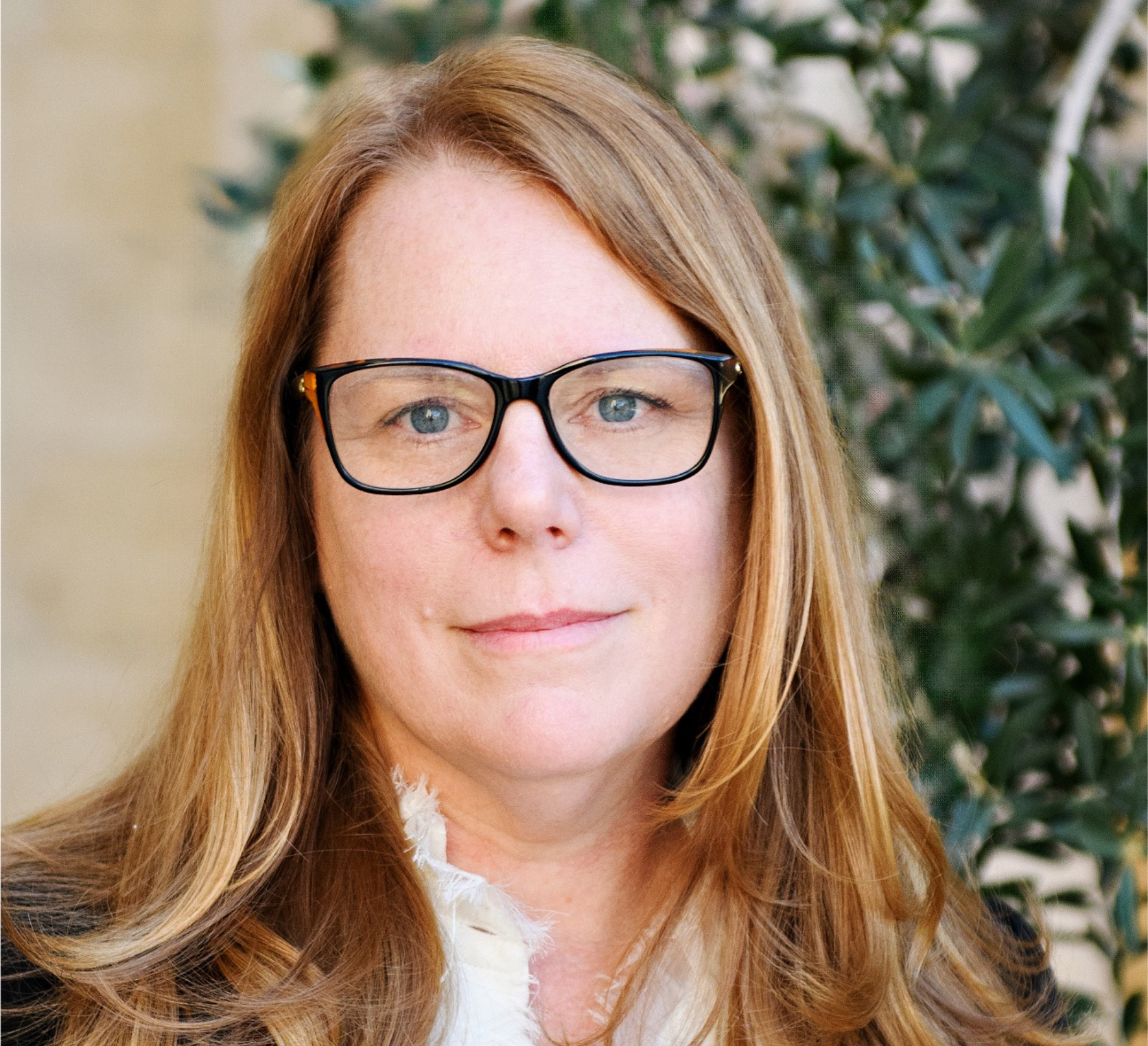 A professional headshot of Shannon Bell