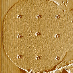 A cross-section of a gold free air ball with Vicker's nanoharness indentation marks