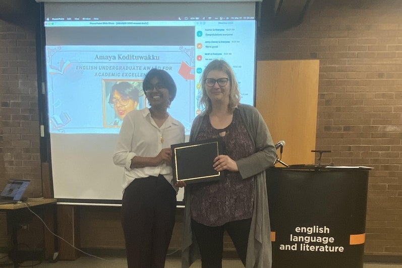 Amaya Kodituwakku  receives the English Undergraduate Award for Academic Excellence from Dr. Victoria Lamont.