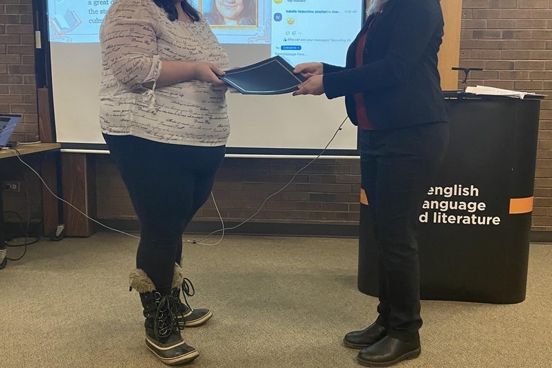 Nadia Formisano receives the Janice Del Matto Memorial Award in Creative Writing  from Dr. Heather Smyth.