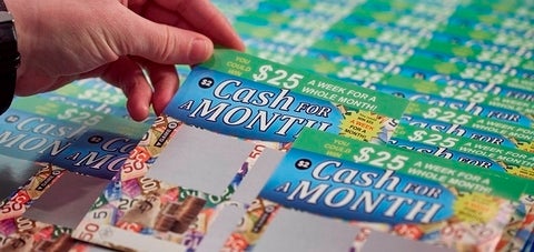 Photo of cash for month card being chosen